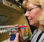 A Mepps Employee Paints Fishing Spinner Blades