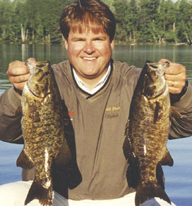 Two small-mouth bass that nailed his Mepps SpinFlex